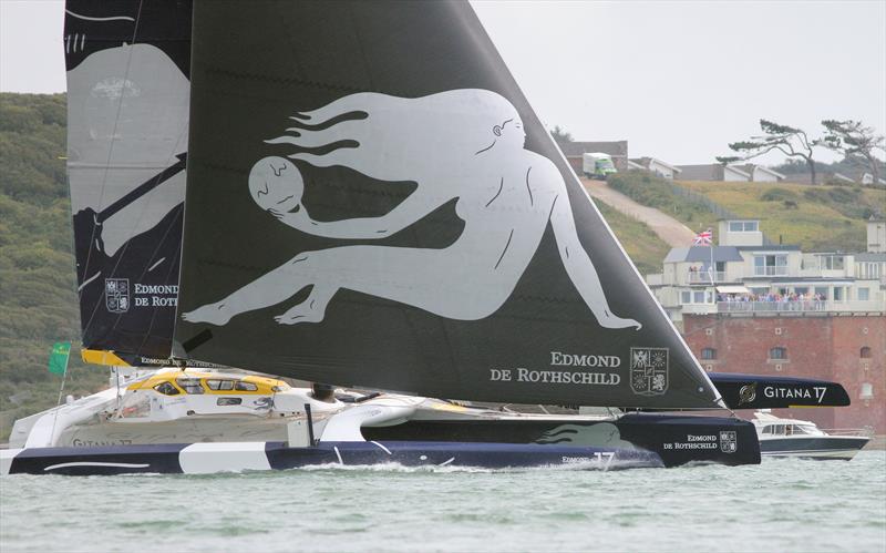 Gitana 17 passes Hurst Castle in the 2019 Rolex Fastnet Race photo copyright Mark Jardine taken at Royal Ocean Racing Club and featuring the Trimaran class