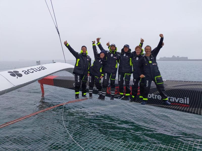 Yves le Blevec and the team on Ultime Actual celebrate after arriving at the Rolex Fastnet Race finish line in an elapsed time of 1d 18h 41m 22s  photo copyright Team Actual taken at Royal Ocean Racing Club and featuring the Trimaran class