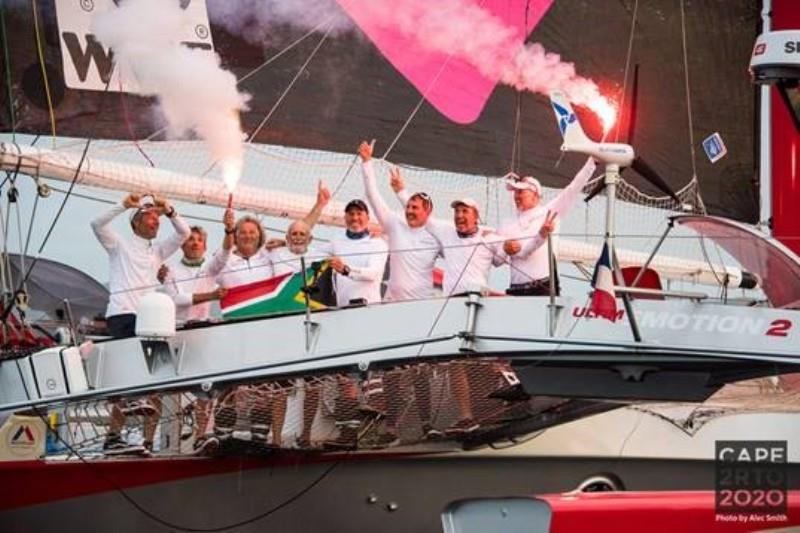 Love Water finish celebration - Cape2Rio2020 Ocean Race, Day 16 photo copyright Alec Smith taken at Royal Cape Yacht Club and featuring the Trimaran class