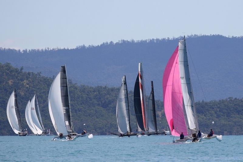 Multihull Racing down the run - 2020 Airlie Beach Race Week day 5 photo copyright Shirley Wodson / ABRW taken at Whitsunday Sailing Club and featuring the Trimaran class
