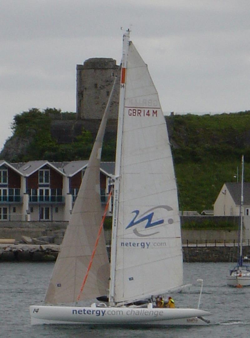 Ross Hobson finishing the Round Britain and Ireland Race photo copyright RWYC of England taken at Royal Western Yacht Club, England and featuring the Trimaran class