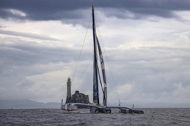 The French trimaran Maxi Edmond De Rothschild was the first yacht to reach the Fastnet Rock, rounding at 0800 BST on the second day. Maxi Edmond De Rothschild passing the Fastnet Rock Maxi Edmond De Rothschild, Sail no: FRA17 - Rolex Fastnet Race photo copyright Rolex / Kurt Arrigo taken at Royal Ocean Racing Club and featuring the Trimaran class