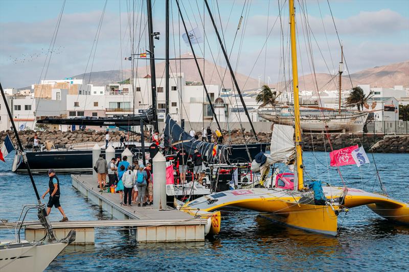 The docks at Marina Lanzarote are buzzing as teams get ready for the long race ahead photo copyright James Mitchell taken at Royal Ocean Racing Club and featuring the Trimaran class