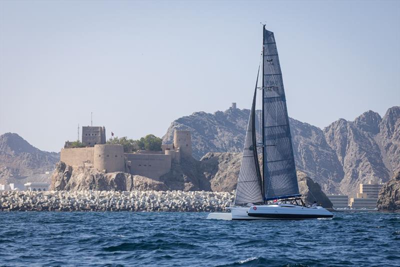 Xavier Bouin's Tan 3 crossing the finish line in Muscat to claim D2M line honours photo copyright Mikey Brignall / DOSC taken at Dubai Offshore Sailing Club and featuring the Trimaran class