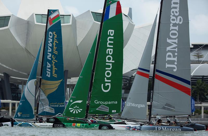 Oman Air, Groupama sailing team and J.P. Morgan BAR race ahead of Singapore's ArtScience museum on day 2 of Extreme Sailing Series Act 1, Singapore - photo © Lloyd Images