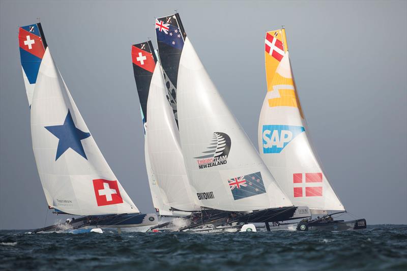 Emirates Team New Zealand blast downwind, leading the fleet in Muscat on day 4 of Extreme Sailing Series Act 2 photo copyright Lloyd Images taken at Oman Sail and featuring the Extreme 40 class