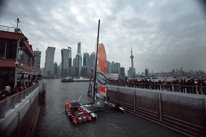 Land Rover's Extreme 40 is the first professional racing yacht to sail down the Huangpu River photo copyright Alex Wang / Land Rover taken at  and featuring the Extreme 40 class