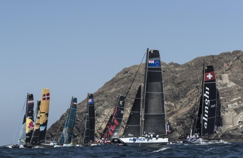 Extreme Sailing Series 2017 Muscat, Oman. The fleet racing close to the shore and historic town of Mutrah photo copyright Lloyd Images taken at  and featuring the Extreme 40 class