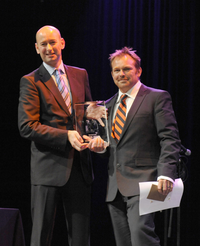 James Collett, Director of Commercial Solutions for Inmarsat, presents Ericsson 4's Guy Salter from the Isle of Wight, UK, with the Media Crew Member award during the Volvo Ocean Race Leg 1 Prize Giving photo copyright Rick Tomlinson / Volvo Ocean Race taken at  and featuring the Volvo 70 class