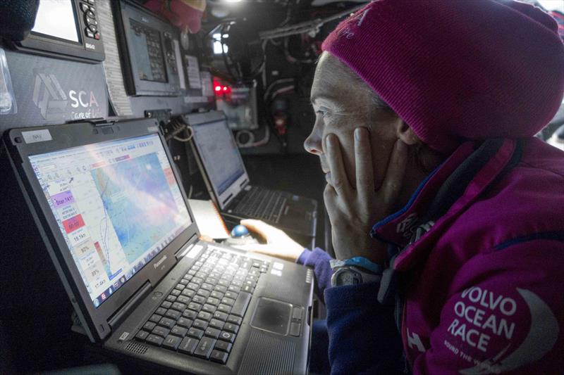 Libby Greenhalgh studies the position report on Team SCA photo copyright Team SCA taken at  and featuring the Volvo One-Design class