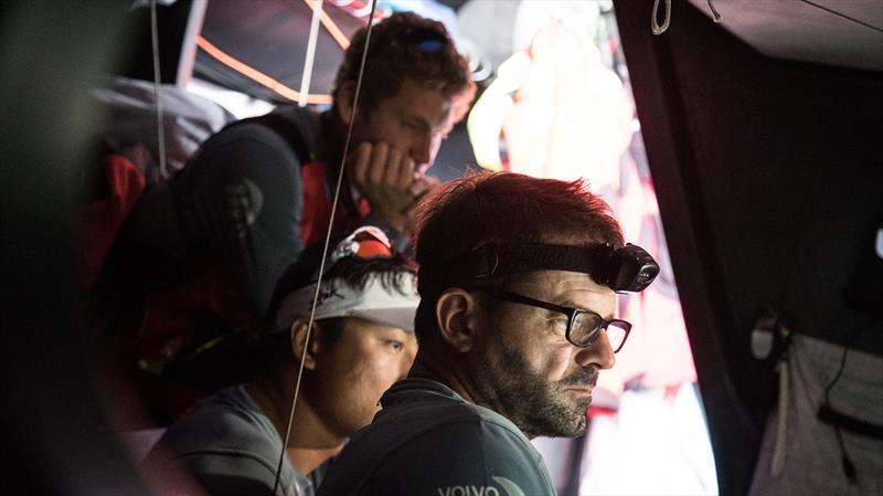 Crew looking frustrated around the Nav Station during Volvo Ocean Race Leg 1: Alicante to Lisbon photo copyright Rich Edwards / Volvo Ocean Race taken at  and featuring the Volvo One-Design class