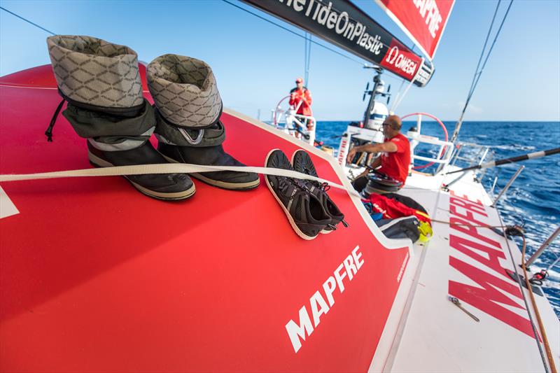 Onboard MAPFRE the sailors try and dry their boots whilst there are no waves crashing over the deck photo copyright Ugo Fonolla / Volvo Ocean Race taken at  and featuring the Volvo One-Design class