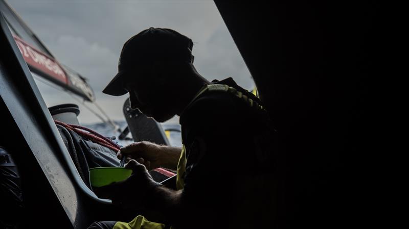 Maciel Cicchetti settles down to have some breakfast during Volvo Ocean Race leg 2 photo copyright Rich Edwards / Volvo Ocean Race taken at  and featuring the Volvo One-Design class