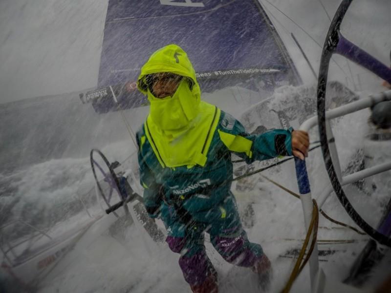 Martine Grael (BRA) turns her back on the stinging sea spray during team AkzoNobel's record setting 24-hour run on Leg 9 of the Volvo Ocean Race photo copyright Konrad Frost / Volvo Ocean Race taken at  and featuring the Volvo One-Design class