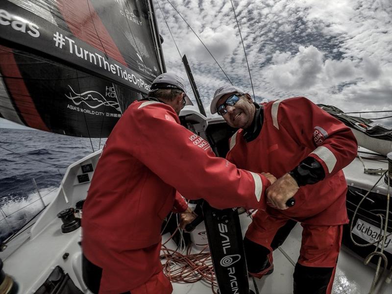 Volvo Ocean Race Leg 4, Melbourne to Hong Kong, day 6 David Witt and John Fisher working hard on the pedestal to trim the sails on board Sun Hung Kai / Scallywag. - photo © Konrad Frost / Volvo Ocean Race