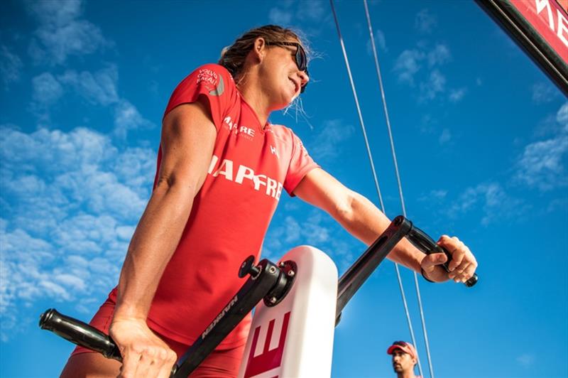 Volvo Ocean Race Leg 4, Melbourne to Hong Kong, day 10 on board MAPFRE, Sophie Ciszek triming at the mid pedestal and looking at Turn the Tide in the horizon photo copyright Ugo Fonolla / Volvo Ocean Race taken at  and featuring the Volvo One-Design class