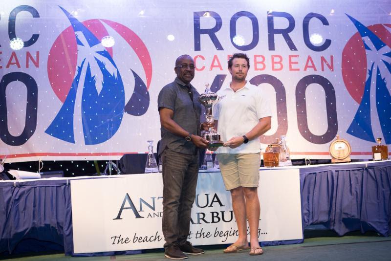 The Hon. E.P. Chet Greene, Ministry of Foreign Affairs, International Trade and Immigration presents the overall winners trophy to a member of David and Peter Askew's Volvo 70 Wizard - 2019 RORC Caribbean 600 - photo © Arthur Daniel