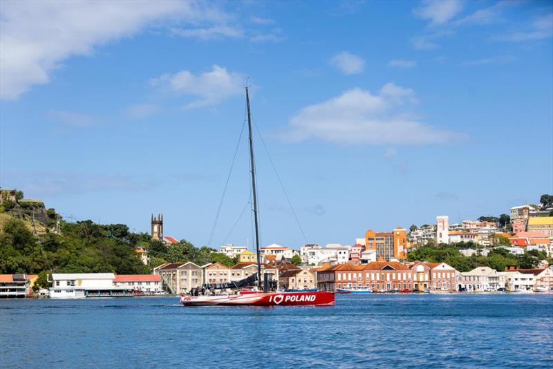 I Love Poland makes her way to the dock and waiting crowds at Port Louis Marina - 2023 RORC Transatlantic Race photo copyright Arthur Daniel / RORC taken at Royal Ocean Racing Club and featuring the Volvo 70 class