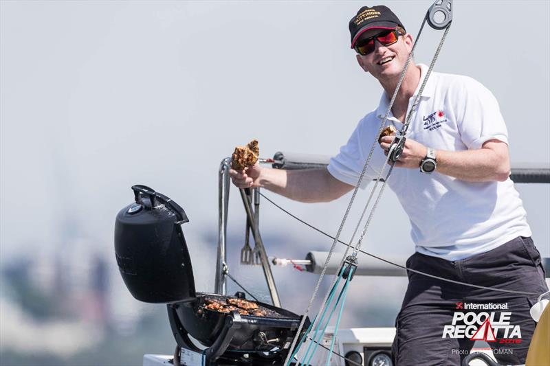 Ed Wilton barbeques while helming on Tom Tit during the International Paint Poole Regatta 2018 - photo © Ian Roman / International Paint Poole Regatta