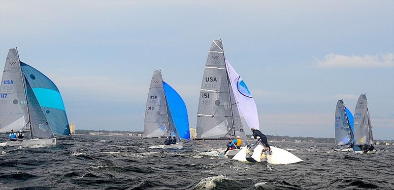 Sarah Alexander, Katja Sertl and Mariah LeffingwellIn leveraging their boat upright after their capsize, one of five, on Pensacola Bay on the first downwind leg of Race #1 of the VX One Midwinter Championship, Regatta #2 of the Winter Series photo copyright Talbot Wilson taken at Pensacola Yacht Club and featuring the VX One class