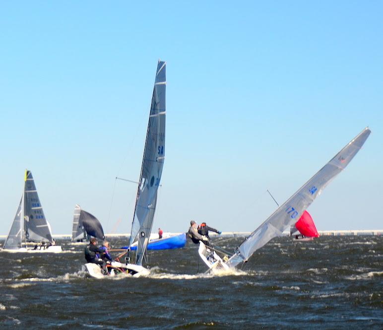 After rounding the leeward gate, Ricky Welch and 'Counterproductive' take a knockdown in the VX One Midwinter Series #3. Four boats capsized in the first race on Saturday when puffs were hitting 22  photo copyright Talbot Wilson taken at Pensacola Yacht Club and featuring the VX One class