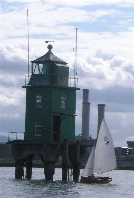 Good Hope at the lighthouse during the Battle of Clontarf Regatta 2014 photo copyright Vincent Delany taken at Clontarf Yacht & Boat Club and featuring the Water Wag class