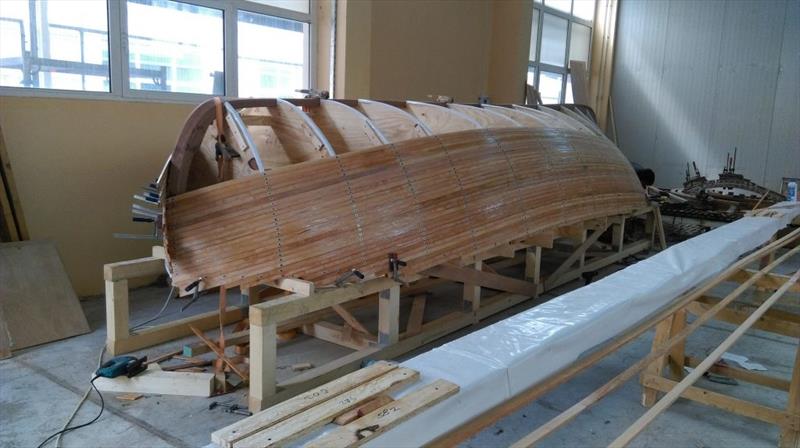 Croatian Gajeta build - The guide batons have allowed the boatbuilders to mark the positions of each strip and to cut them to length with WEST SYSTEM epoxy - photo © West System International