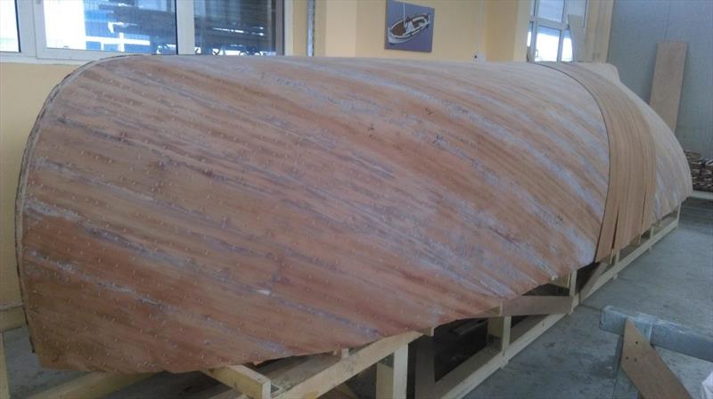 Croatian Gajeta build - between layers the whole hull is sanded fair to remove excess adhesive mix - photo © West System International