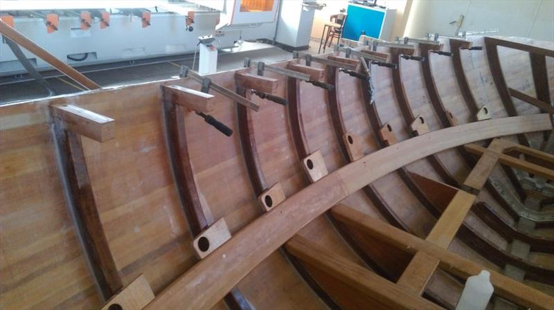 The longitudinal stringers were sanded, coated with three layers of protective epoxy and then positioned on each side of the hull. The ‘knees' that will support the deck have been put in as well photo copyright Wessex Resins & Adhesives taken at  and featuring the  class
