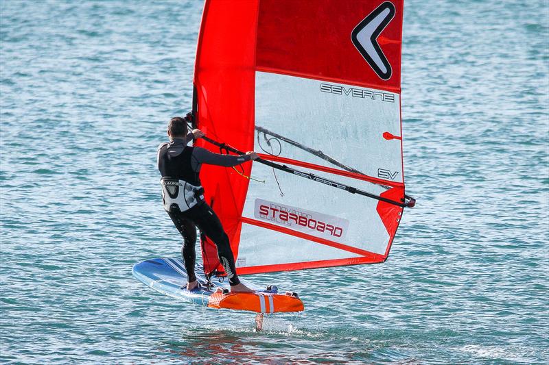 America's Cup Champion Glenn Ashby improving his foiling skills on a Windfoiler - Midwinter Series- Wakatere BC, July 2019 photo copyright Richard Gladwell taken at Wakatere Boating Club and featuring the WindRider class