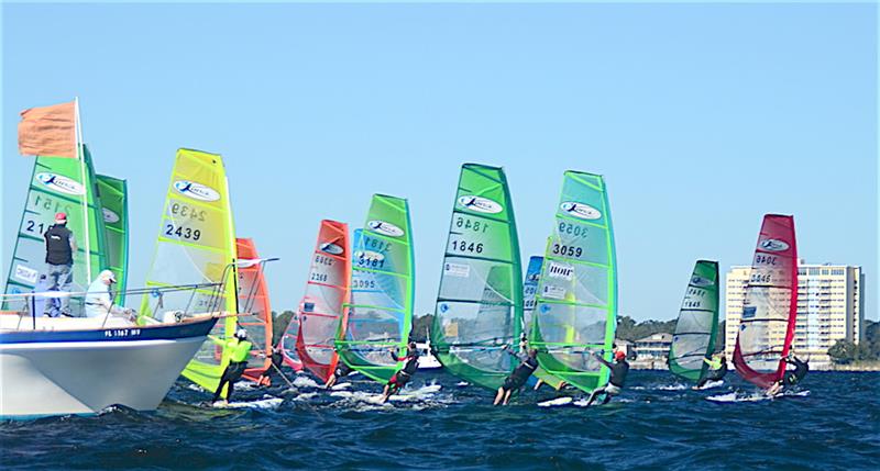 Men, women, masters and under 18's sail in one large fleet in different weight divisions designated by sail color from Yellow for light to Orange for heavy. There are five rainbow colors in all - 2018 Kona North American championship  photo copyright Talbot Wilson taken at Pensacola Yacht Club and featuring the Windsurfing class