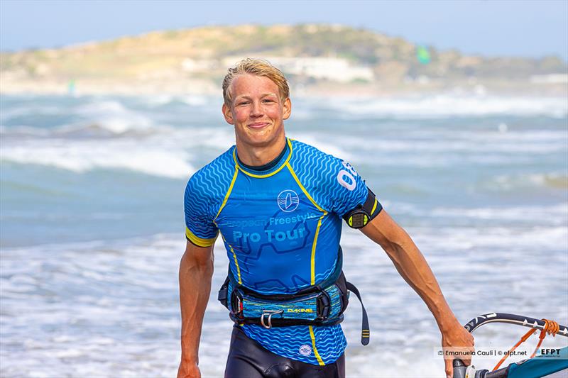 Tim's always running around the beach with a smile! - photo © Emanuela Cauli