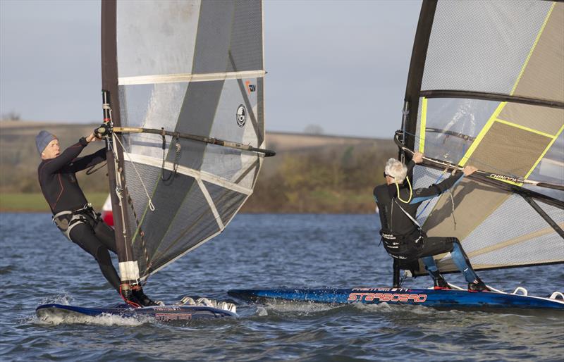 Gerrty Ball leading Guy Sprekley in the windsurf fleet at the Notts County SC First of Year Race in aid of the RNLI photo copyright David Eberlin taken at Notts County Sailing Club and featuring the Windsurfing class