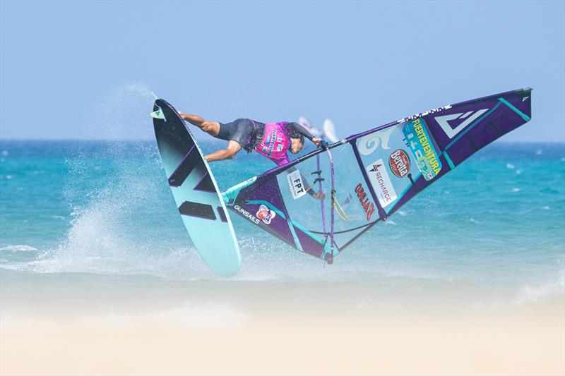 Jacopo Testa styles his way through a shuvit spock on Day 7 of the Fuerteventura PWA Grand Slam photo copyright Inna Bru taken at  and featuring the Windsurfing class