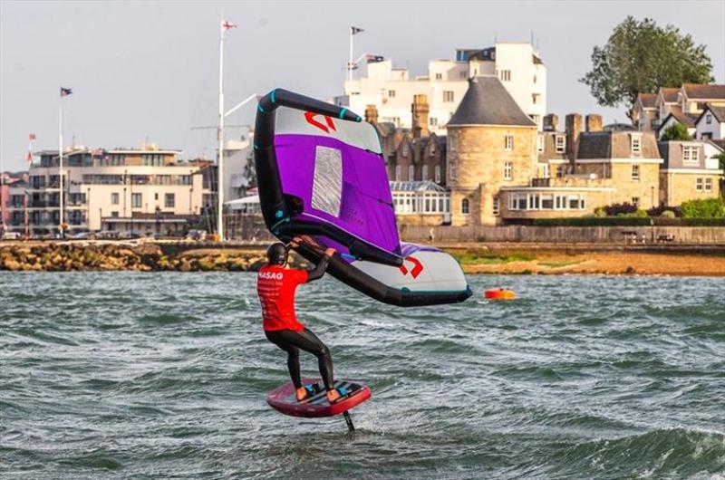 Tom Court wing foiling the Royal Yacht Squadron, Cowes photo copyright John Carter taken at Island Sailing Club, Cowes and featuring the Wing Foil class