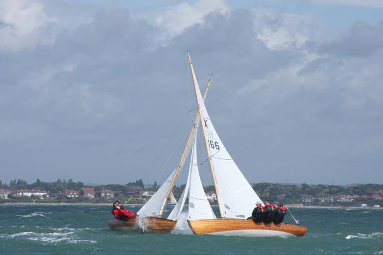 Simon Russell in Swallow crossing Stuart Jardine in Lone Star at Skandia Cowes Week 2008 photo copyright Eddie Mays taken at  and featuring the XOD class